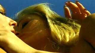 Petite blonde lesbians having fun by the pool