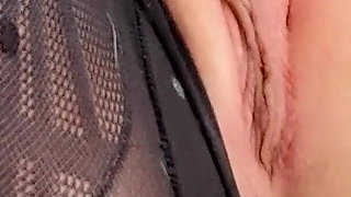 Slutty Woman Masturbates Her Shaved Pussy with a Dildo in Torn Pantyhose and Orgasms Close-up