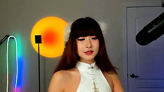 Asian babe sucking and jerking two hard dicks