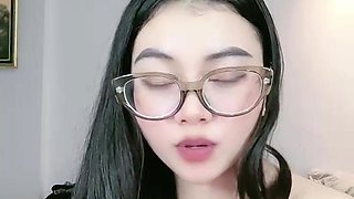 Beautiful Asian Woman Shows Off Cleavage