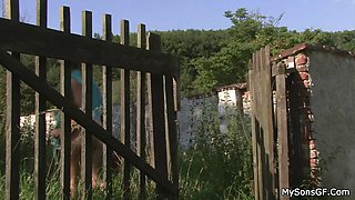Old man toying teen girl outdoors