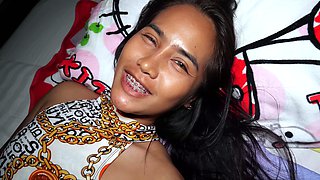 Guy feeding a hot Thai teens hairy pussy
