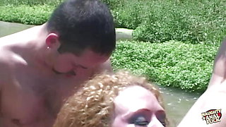 Hardcore smashing holes in a threesome of a redhead vixen in the outdoors