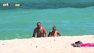 Hot nudist chick secretly filmed on the beach by a voyeur