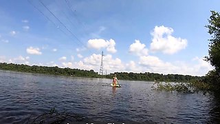 Big-Ass Blonde Rides a SUP Board Naked on a Beach