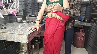 In the kitchen, the brother-in-law made the beautiful sister-in-law in red saree do the doggy style and fucked her.