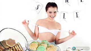 Soloing young brunette Kylie Quinn plays with her soft shaved pussy