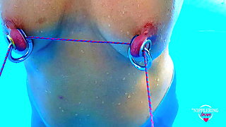nippleringlover horny milf self nipple bondage in pool pierced nipples bound with string pulled hard