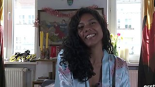 Sexy black-haired honey jerks outdoors