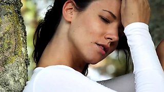 Slender German MILF strips nude outdoors