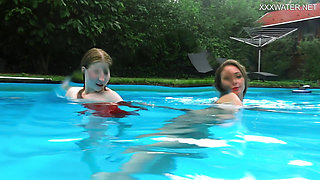 Girlfriends enjoy swimming naked together