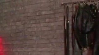 Humiliating man in gas mask