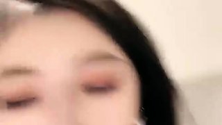 Asian babe sucking and jerking two hard dicks