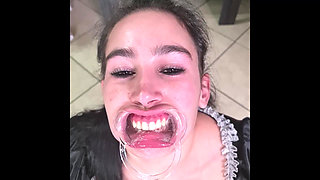French Maid Tries to Swallow Her Own Piss Through Lip Retractor