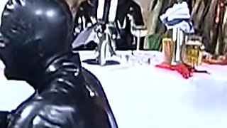 Elegant Latex Mistresses Tease Bound Rubber Slaves