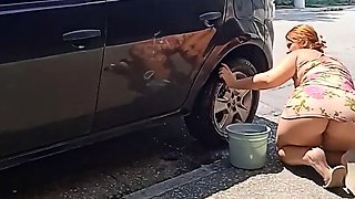 HOT GIRL WASHES HER CAR SHOWING OFF ON THE STREET