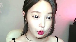 Busty Korean teen camgirl in pantyhose masturbates