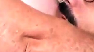 Busty brunette fingering her snatch close up