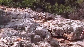 Lustful blonde Kelly Trump masturbates on rocks