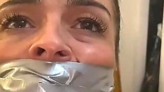 Latina Tied up and Gagged with a Tape Wrap (smaller Size)