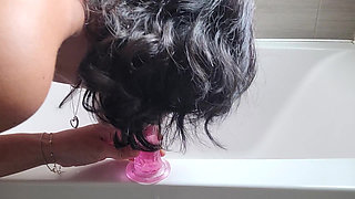 MILF gives herself pleasure in bathroom