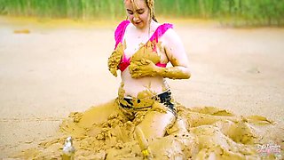 German teen masturbates to orgasm in muddy lake - wet and messy solo fingering