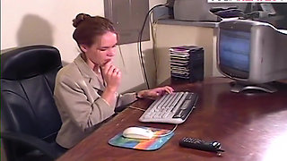 Horny babe fingers her pussy on the desk