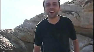 Young couple film a romantic fuck on a beach