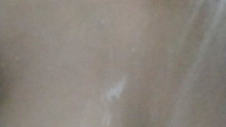 Staife in a shower and play with her breasts