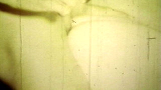 Worn Sepia Loop Captures Curly Retro Couple in Raw Bedroom Passion