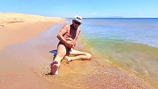 Nudist Couple Having Pegging Session On The Beach