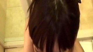 A Smooth-skinned Beauty Shares a Tender Moment Beneath the Warmth of the Shower.