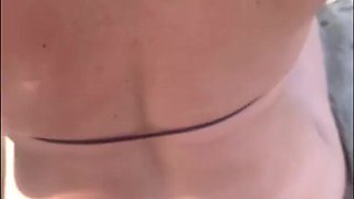 Redhead babe rests on the beach and then massages stranger's cock