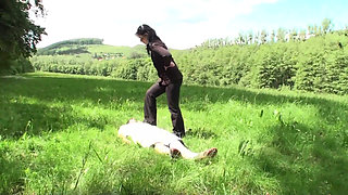 Outdoor trampling punishment with muddy shoes