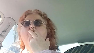 BBW smoking in pink sweater in her car talking to her fans
