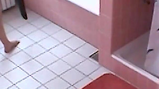 Amateur blonde masturbates on toilet