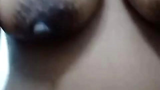 Lonely widow shows off her breasts before taking a shower