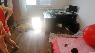 Amateur woman has fun trying on clothes and cutting them.
