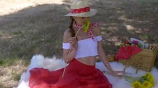 A freckled youthful girl uses adult toys during a