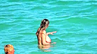 Shameless amateur fisted on a public beach