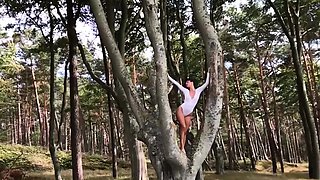 Slender German MILF strips nude outdoors