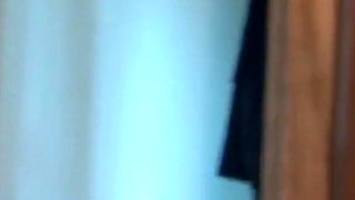 Sexy lesbian couple kiss passionately as they undress each other