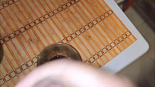 Ejaculating into a coffee cup and waking my slave to drink it.