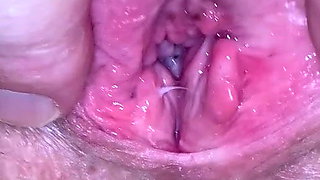 Milf plays with huge pierced clit