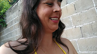 Amateur wife teasing you outside wearing a micro bikini