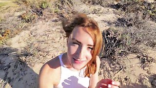 Dazzling redhead teen gives a hot POV blowjob on the beach