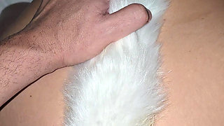 My ass is plugged with a foxtail while he fucks my pierced pussy hard