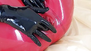 OnlyFans teaser - This is my red latex catsuit with integrated condoms!