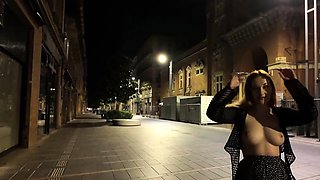 Naughty redhead teen flashing her perky tits in public