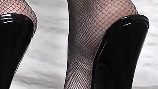 Goddess of High Heels Shows off Her Black Patent Leather Mules